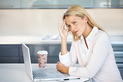 Tension - Business woman with hand on head at work