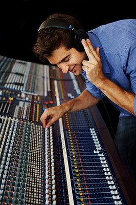 Young man in music recording studio