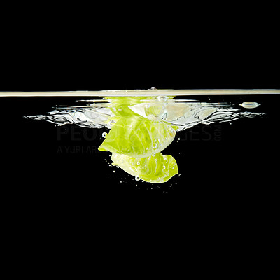 Lettuce leaf splashing into water