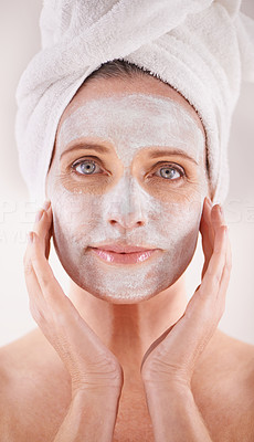 Pampering her skin with a face mask