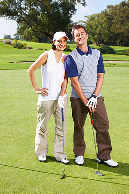 Couple standing on the golf course