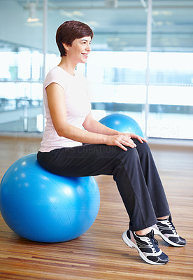 Woman sitting on gymnastic ball