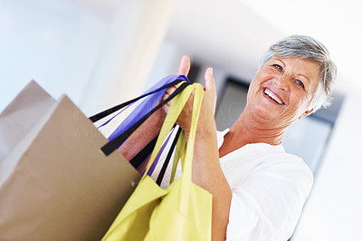 Mature woman with shopping bags