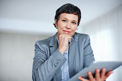 Successful business woman using tablet PC