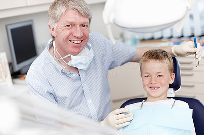 Smiling dentist with child