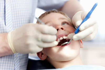 Boy getting his teeth checked