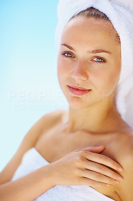 Elegant young spa woman in a towel after her bath