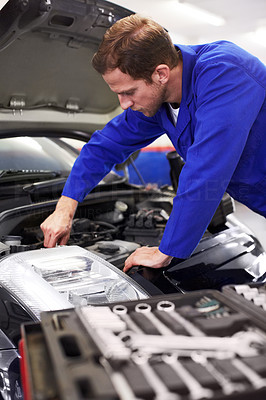 His tools assist him in accurate vehicle maintenance