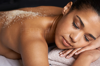 Pampering her skin with an exfoliating treatment