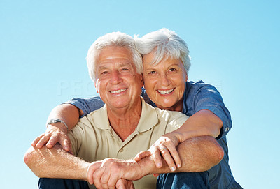 Senior couple giving you an attractive smile