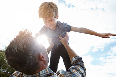 Teaching his son to fly