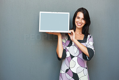 Pretty woman showing laptop