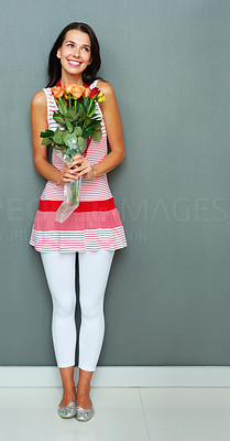 Pretty woman with bunch of flowers