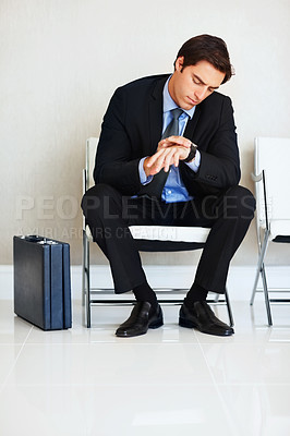 Time is money-Businessman checking the time