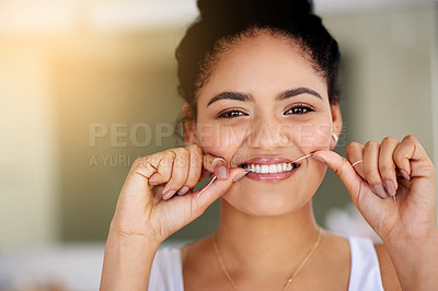 Flossing for the love of her teeth