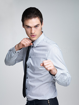Business competition - Young male entrepreneur ready for fight