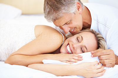Romantic mature couple in bed