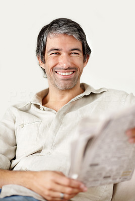 Portrait of smiling mature man with a newspaper