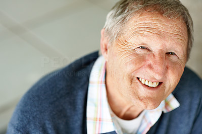 Closeup of smiling old man looking up at you