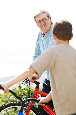 Old man and a little boy on bicycles - Outdoor