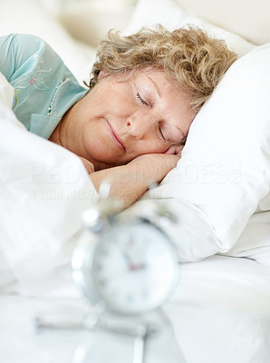 Old woman sleeping on the bed - Indoor