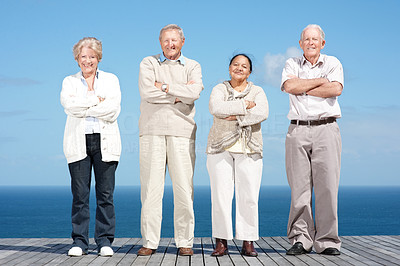Old couples standing with folded hands on the wooden plank