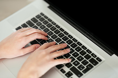 Female hands on keyboard of laptop