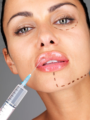 Facial surgery concept - Young woman getting botox injection on