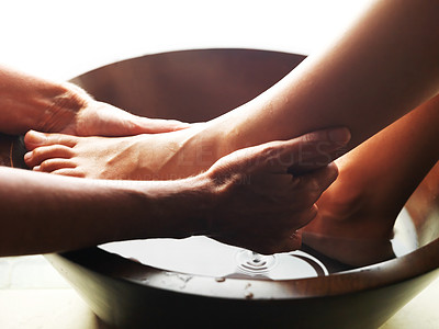 Pedicure - Woman feet receiving a foot massage