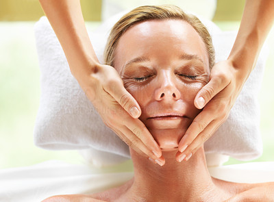 Face massage during a facial at a beauty spa