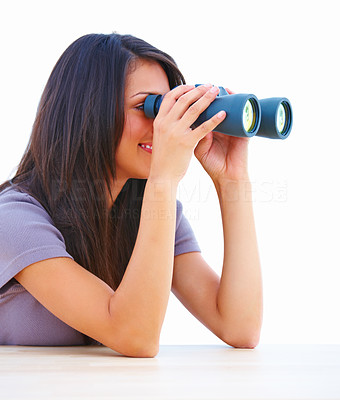 Closeup of a young woman holding binoculars
