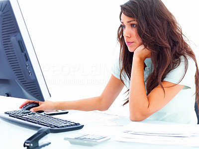 Closeup of a beautiful young business woman working on computer isolated on white background