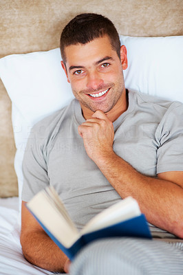 Relaxed young guy reading book - Indoor