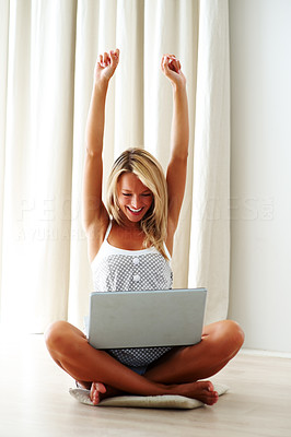 Achievement - Excited young female using laptop