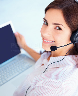 Working hotline from home - happy young customer representative using a laptop