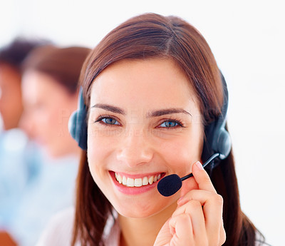 Closeup of a happy young customer representative wearing headset