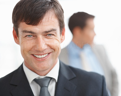 Happy business manager with a blur man isolated against white