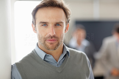 Closeup of a middle aged man with blurred people in background