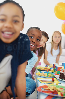 Multi ethnic friends enjoying at a birthday party