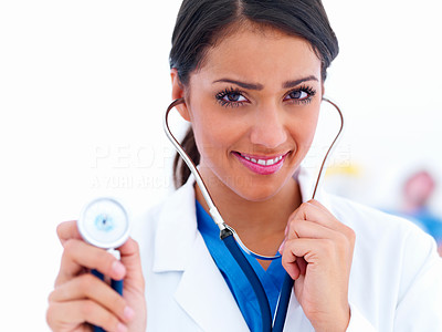 Young smiling doctor holding a stethoscope