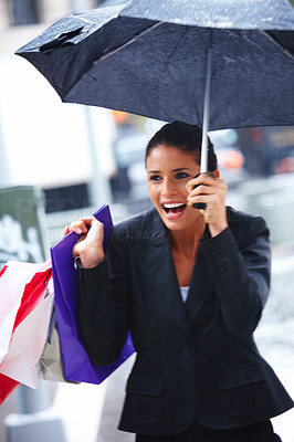 Closeup of a beautiful happy woman holding umbrella