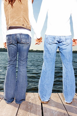 Man and woman standing together on a wooden deck