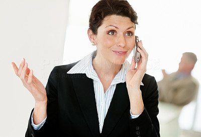Middle aged business woman talking on cellphone