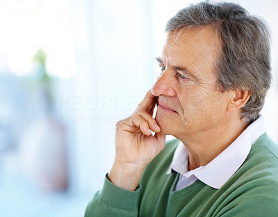 Retired old man lost in deep thought