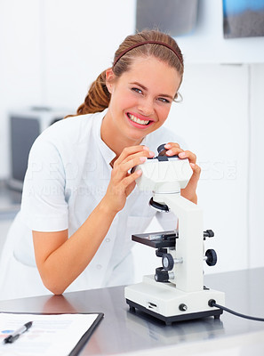 Successful young female researcher working in the laboratory