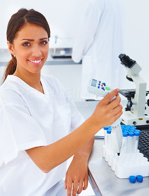 Portrait of a female researcher using laboratory equipments