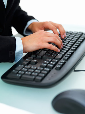 Closeup of a female\'s hand typing on a computer keyboard