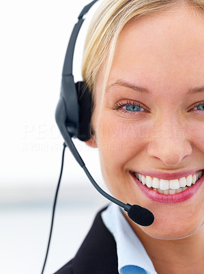 Portrait of a business woman wearing headset on white background