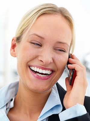 Portrait of a happy young beautiful smiling woman using cell phone