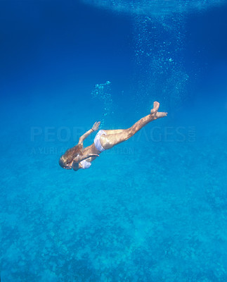 Woman diving in the Ocean